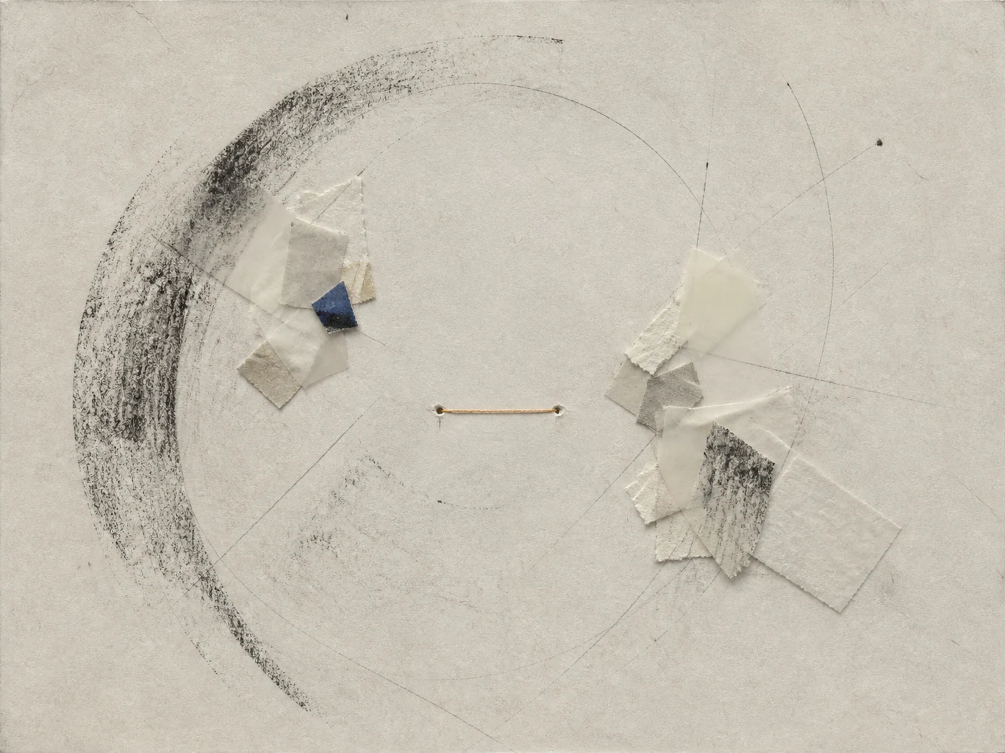 Paper fragments, graphite paths, charcoal arcs, and thread arranged around an open working center